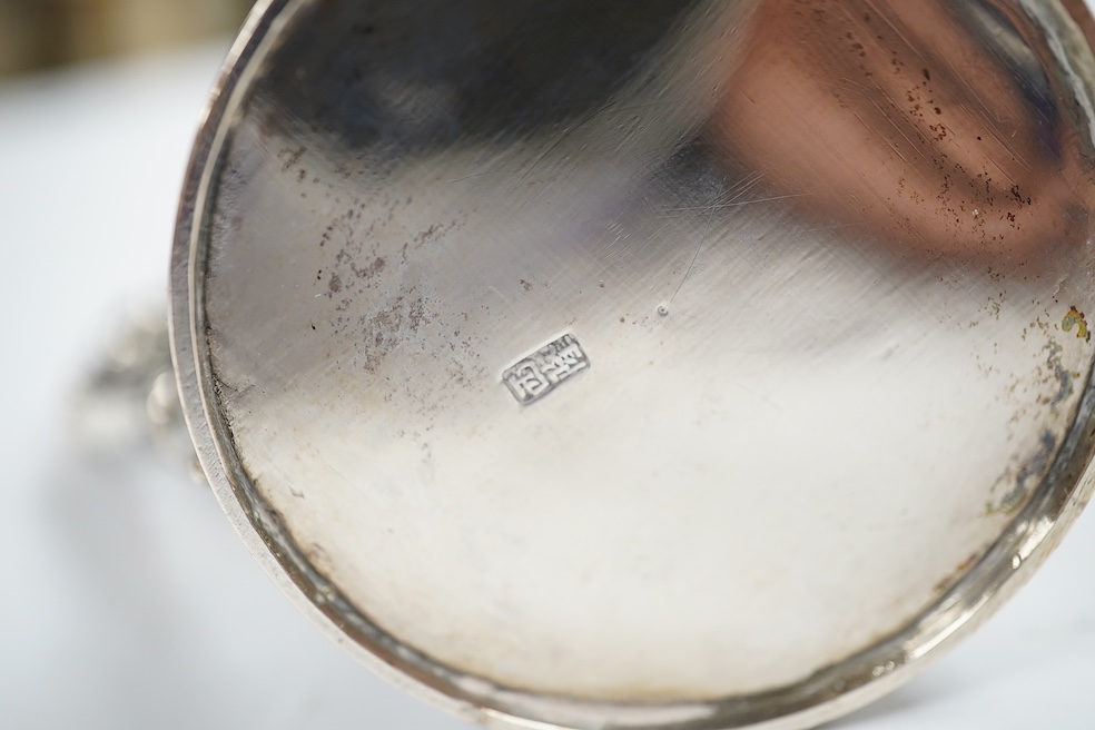 A small Chinese Export white metal mug, embossed with a dragon, 68mm, 66 grams. Condition - fair